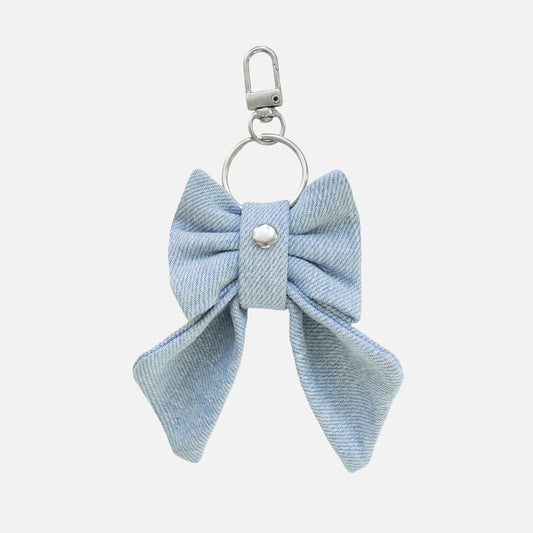 'BOW RIBBON' DENIM BAG CHARM IN LIGHT-WASH