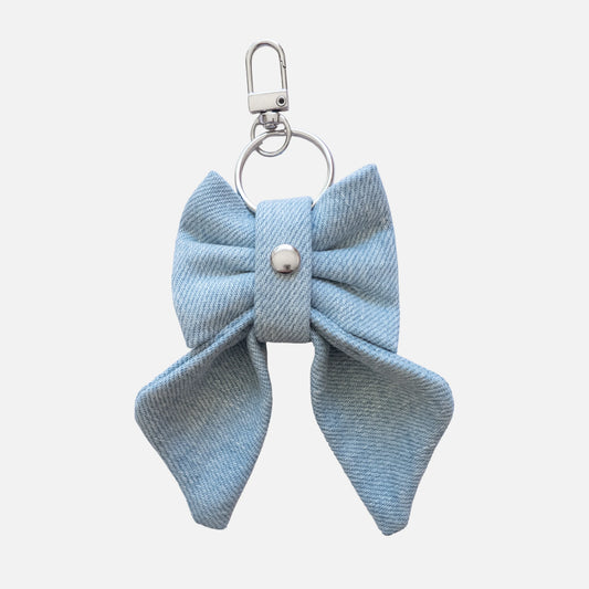'BOW RIBBON' DENIM BAG CHARM IN LIGHT-WASH