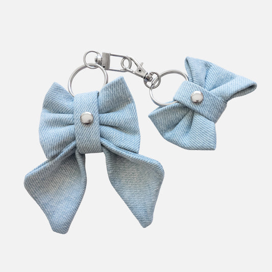 'BOW RIBBON' DENIM BAG CHARM IN LIGHT-WASH